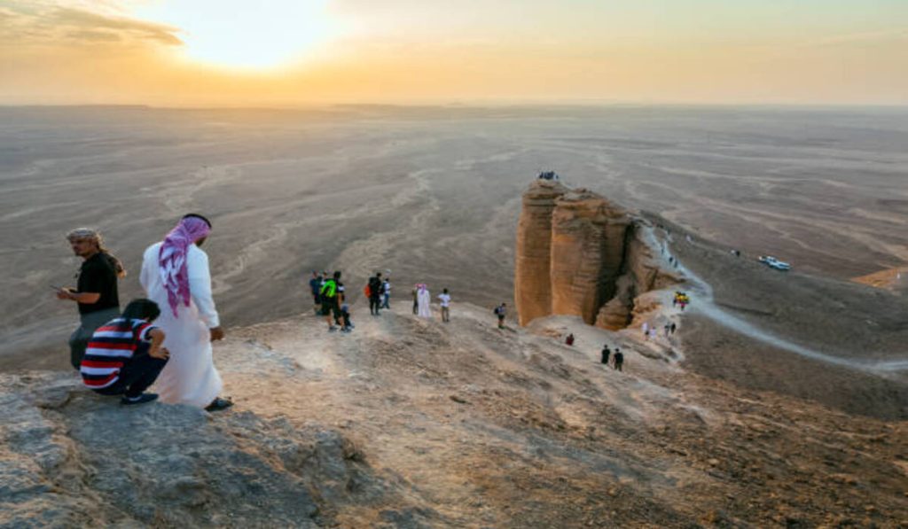 Tourist on Edge of the World, a natural landmark and popular tourist destination near Riyadh